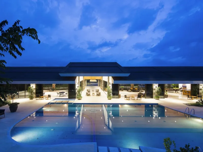 Low contemporary cliffside resort with an infinity pool at blue hour in the Algarve